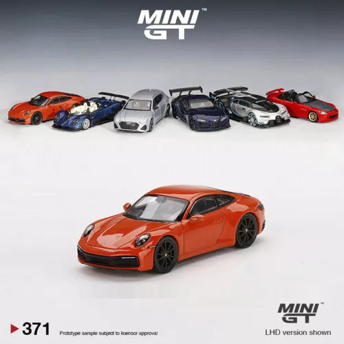 Orange diecast model car, 1:64 scale Porsche 911 front three-quarter view