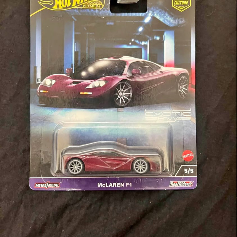 Hot Wheels 1:64 diecast car, maroon coupe with silver wheels in retail box