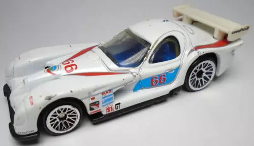 Hot Wheels white die-cast race car with red and blue #66 and rear wing