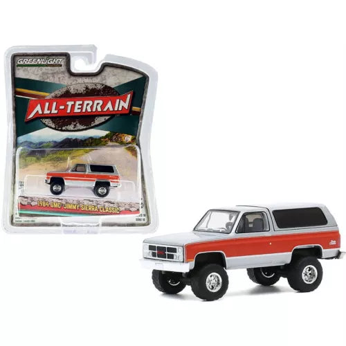 Diecast 1984 GMC Jimmy Sierra Classic SUV toy on blister card, white and red