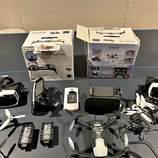 FPV drone set with two Bebop 2 drones, controller, batteries, and charging accessories