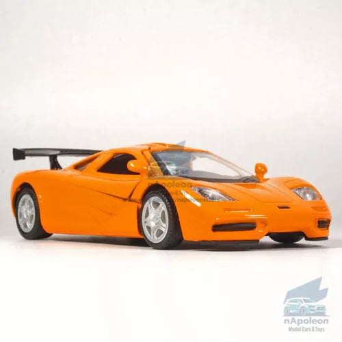 Orange alloy diecast model car with detailed cockpit and front lights