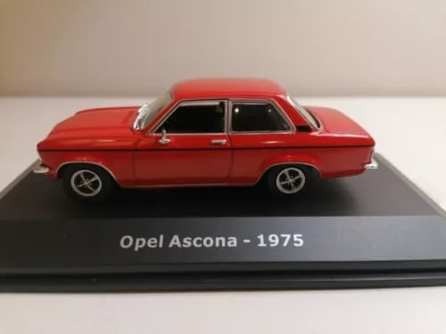 Red 1/43 scale 1975 Opel Ascona die-cast model car on display base