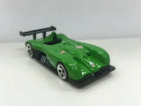 Green 1/64 scale diecast roadster model car with rear wing and open cockpit