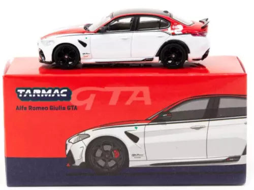 Red and white diecast sports car model on red display box, black wheels