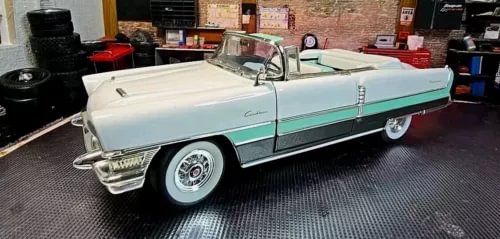 1:18 scale classic diecast model car, light teal body with white roof, chrome details