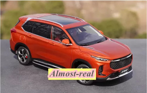 Orange SUV diecast model car with front grille and headlights, 1/18 scale display