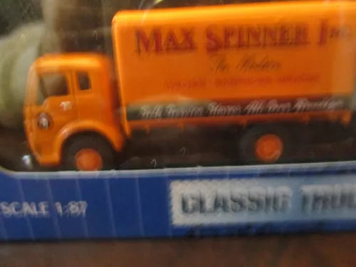 HO scale diecast truck cab, orange Max Spinner Inc. detail view