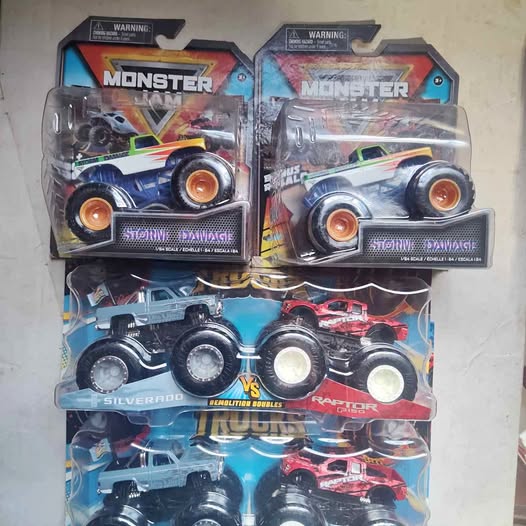 1/64 scale diecast monster truck in clear blister, blue and dark with orange wheels