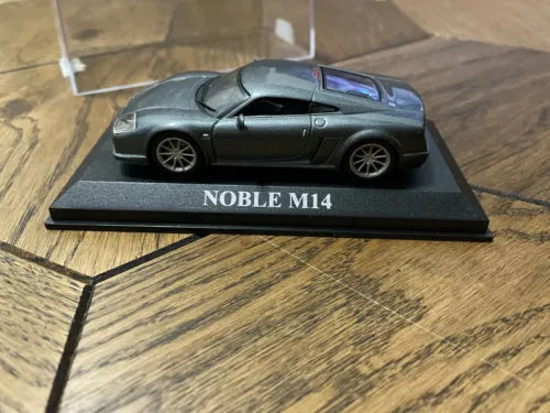 Grey metallic Noble M14 diecast car on base, “NOBLE M14” on front
