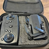 Drone and remote controller in zippered hard case, dark gray