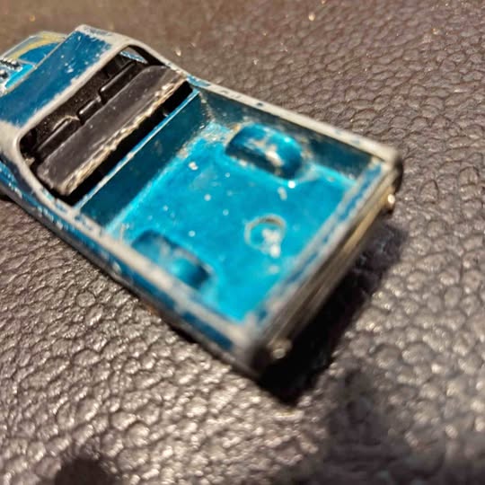 Vintage blue Hot Wheels diecast El Camino pickup car, front-left view, detailed interior