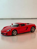 Red Porsche Carrera GT 1:36 diecast toy car, front three-quarter view