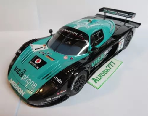 Diecast racing car model with turquoise and black body, rear wing and front details