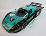 Diecast racing car model with turquoise and black body, rear wing and front details