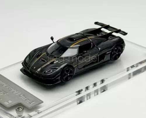 1:64 scale sports diecast metal car, black with carbon-fiber styling, front view