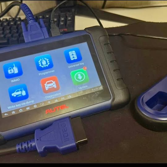 Autel IM508S diagnostic tablet with blue touchscreen and side ports, with blue cable.