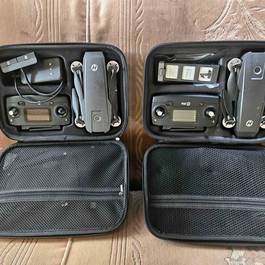 Drone case set with controllers and batteries, open storage compartments