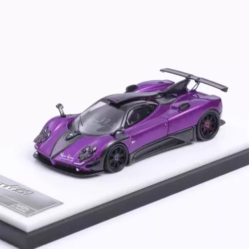 Purple and black diecast sports car model with open cockpit and rear wing