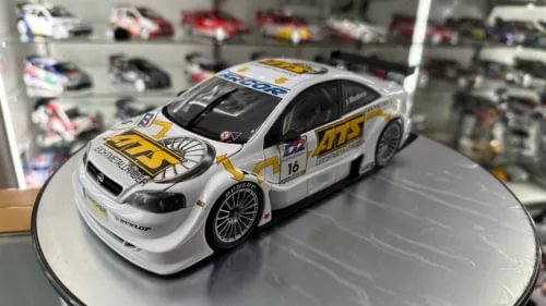 White race coupe diecast model car with number 115, front 3/4 view