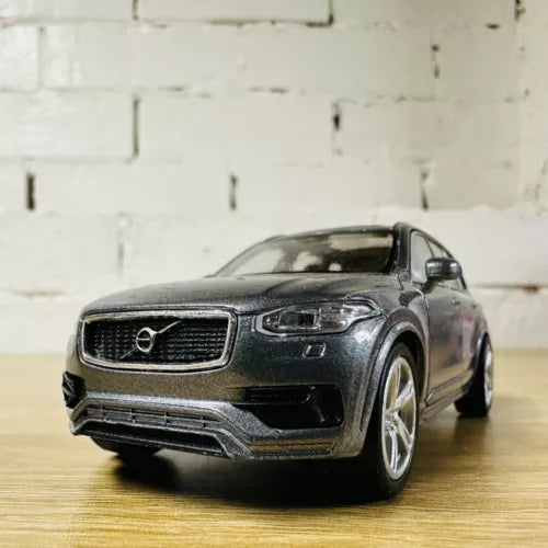 Dark grey diecast SUV toy car, detailed front grille and headlights, 1:36 scale.