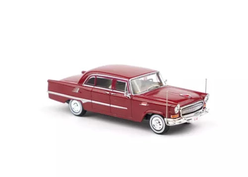 Red 1:64 luxury sedan diecast model car, front 3/4 view