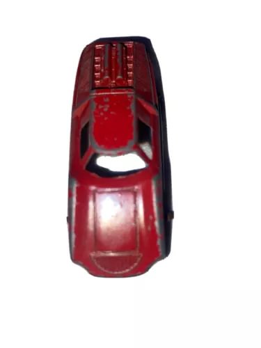 Red diecast toy car front view with grille and headlights