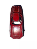 Red diecast toy car front view with grille and headlights