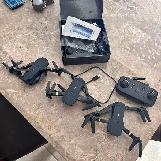 Mini drone set with three foldable drones, remote controller, and USB cable