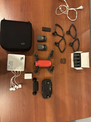 Foldable drone kit with controller, batteries, prop guards, carrying case, cables