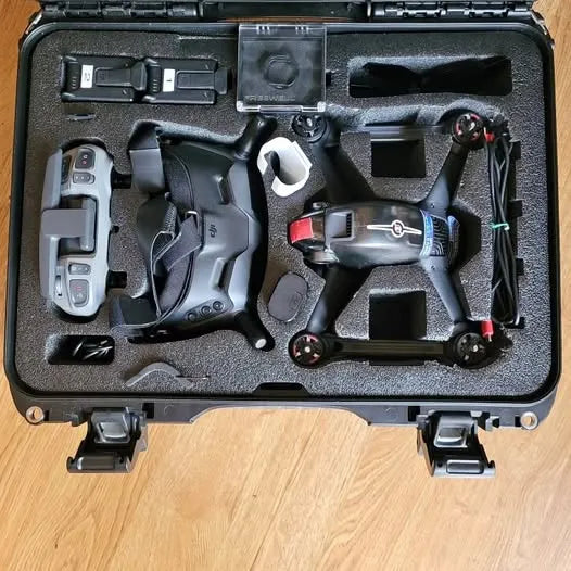 FPV drone kit in foam-lined hard case with controller and batteries