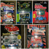 NASCAR diecast car blister packs with race cars in red, green, and blue packaging