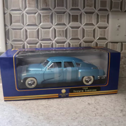 1948 Tucker Torpedo blue diecast car model, front view in display box