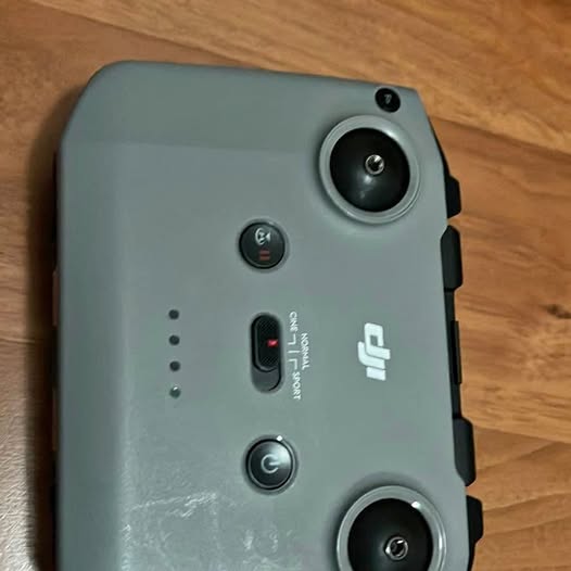 DJI drone body with two camera lenses and visible ports