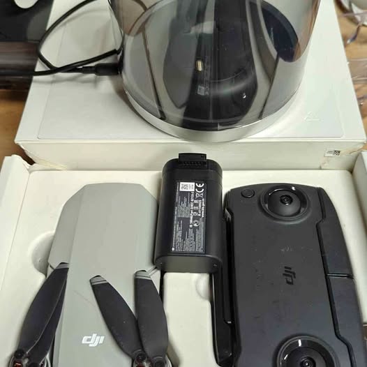 DJI Mavic Mini drone with black battery and propellers