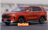 Orange SUV diecast model car with front grille and headlights, black wheels