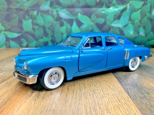 Blue 1948 Tucker scale 1:24 diecast car model, imperfect condition