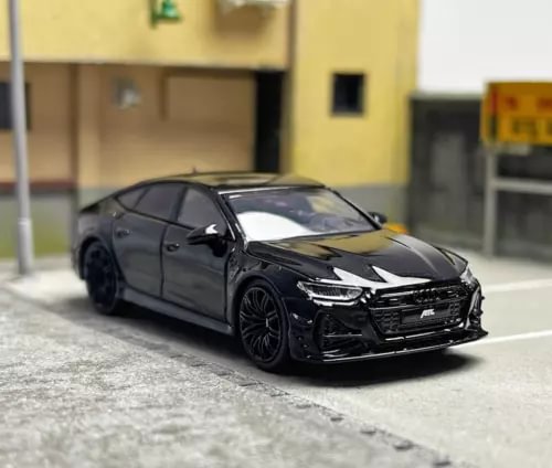 Black diecast sports car model, front three-quarter view