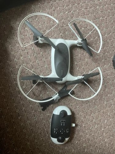 Beginner kids drone quadcopter with four propellers and remote controller