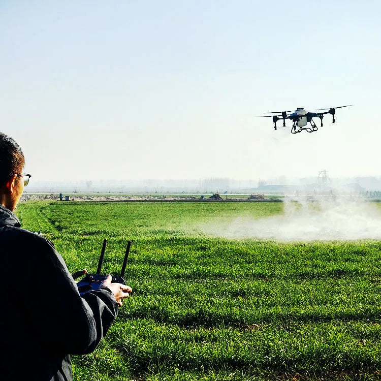 Agricultural spraying drone with quadcopter arms releasing mist over plants