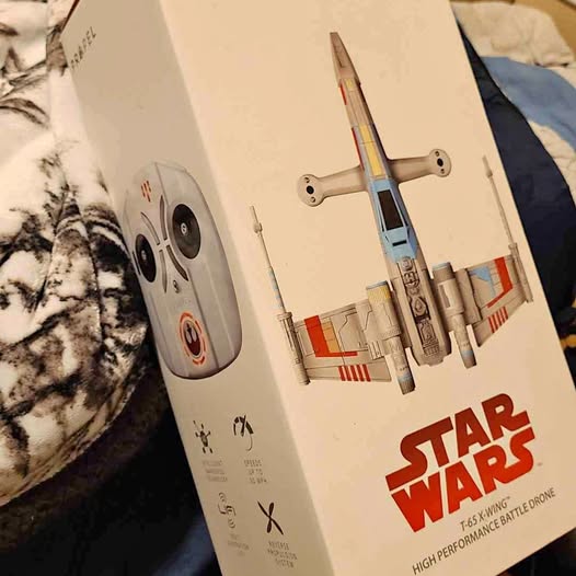Star Wars T-65 X-Wing quadcopter battle drone product box with illustrated drone
