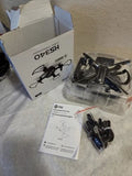HD camera drone kit with black quadcopter, parts bag, and instruction manual
