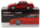 Red metallic diecast car toy, two-door coupe with detailed wheels, on display box