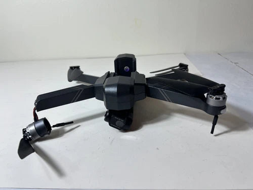 Gray 4K camera drone with 2-axis gimbal, four propellers and landing legs