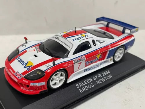 Red, white and blue race car diecast model with rear wing on base