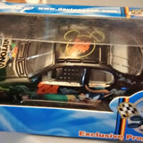 Diecast truck in clear box, close-up; “Exclusive” label on packaging