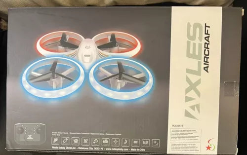 Colorful kids drone with four glowing LED prop rings, shown on retail box front