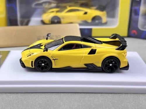 Yellow diecast sports model car toy with black wheels