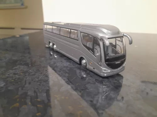 Grey diecast bus/coach model, front 3/4 view with detailed grille and headlights