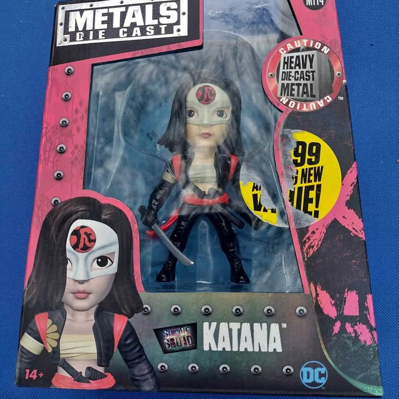 Diecast katana collectible box with anime-style figure and sword graphic, DC badge